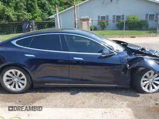 2014 Tesla Model S 60 with VIN 5YJSA1H17EFP65983, listed as a IAAI auction lot 42399288 with 166,365 mi miles and . Bid and sale history available at DreamBid. Image 14.