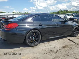 2015 BMW M6 z VIN WBS6C9C50FD467779, wystawiony jako Copart lot #56702794 z przebiegiem 78 259 mil mil oraz Szkody całkowita. Historia ofert i sprzedaży dostępna na DreamBid. Obrazek 3.