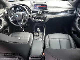 2021 BMW X1 xDrive28i with VIN WBXJG9C0XM5U47141, listed as a Copart auction lot 60645865 with 56,106 mi miles and Salvage title. Bid and sale history available at DreamBid. Image 8.