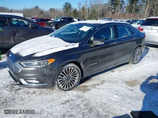 2018 Ford Fusion Hybrid Titanium with VIN 3FA6P0RU1JR101826, listed as a IAAI auction lot 41384334 with 69,039 mi miles. Bid and sale history available at carsss.com. Image 2.