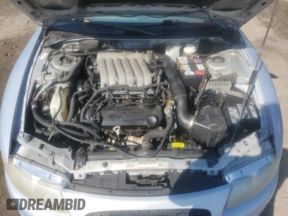 1997 Chrysler Sebring LXi z VIN 4C3AU52NXVE180034, wystawiony jako Copart lot #73413994 z przebiegiem 123 637 mil mil oraz Tytuł czysty. Historia ofert i sprzedaży dostępna na DreamBid. Obrazek 11.