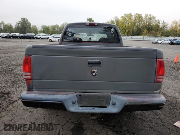 2003 Dodge Dakota Sport with VIN 1D7HL38N63S192308, listed as a Copart auction lot 77494684 with 128,512 mi miles and Salvage Title. Bid and sale history available at carsss.com. Image 6.