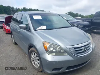 2010 Honda Odyssey EX-L z VIN 5FNRL3H73AB099143, wystawiony jako IAAI lot #42548972 z przebiegiem 205 774 mil mil oraz . Historia ofert i sprzedaży dostępna na DreamBid. Obrazek 1.
