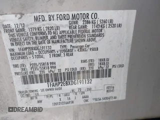 2013 Ford Taurus SEL with VIN 1FAHP2E8XDG191132, listed as a IAAI auction lot 41833542 with 165,125 mi miles. Bid and sale history available at carsss.com. Image 9.