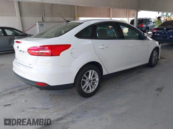 2017 Ford Focus SE with VIN 1FADP3F2XHL342823, listed as a IAAI auction lot 42496940 with 97,263 mi miles and . Bid and sale history available at DreamBid. Image 4.