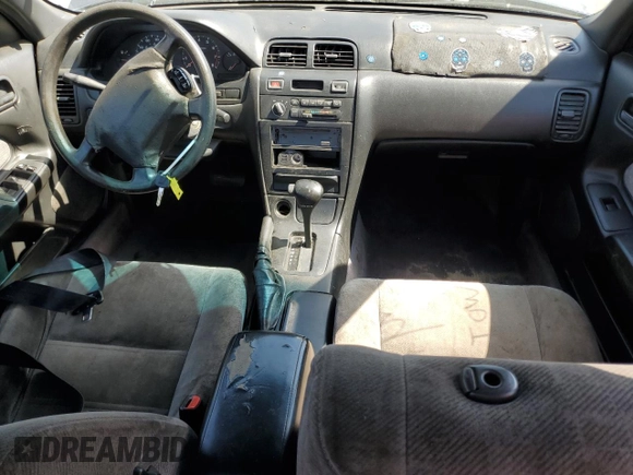 1999 Nissan Maxima GXE z VIN JN1CA21D9XM409448, wystawiony jako Copart lot #51822895 z przebiegiem Nie podano mil oraz Szkoda całkowita • Salvage title. Historia ofert i sprzedaży dostępna na DreamBid. Obrazek 8.