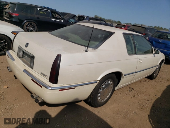 2000 Cadillac Eldorado z VIN 1G6EL12Y2YU179560, wystawiony jako Copart lot #70635784 z przebiegiem 92 959 mil mil oraz Czysty tytuł • Clean title. Historia ofert i sprzedaży dostępna na DreamBid. Obrazek 3.