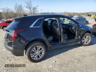 2023 Cadillac XT5 FWD Premium Luxury with VIN 1GYKNCR48PZ132957, listed as a Copart auction lot 42132845 with 27,312 mi miles and Salvage Title. Bid and sale history available at carsss.com. Image 3.