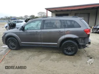 2019 Dodge Journey SE with VIN 3C4PDCBG6KT869075, listed as a Copart auction lot 47589345 with 64,482 mi miles and Salvage Title. Bid and sale history available at DreamBid. Image 2.
