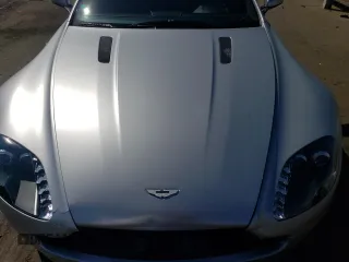 2006 Aston Martin Vantage z VIN SCFBB03B76GC02094, wystawiony jako Copart lot #69683434 z przebiegiem 26 353 mil mil oraz Szkoda całkowita • Salvage title. Historia ofert i sprzedaży dostępna na DreamBid. Obrazek 11.