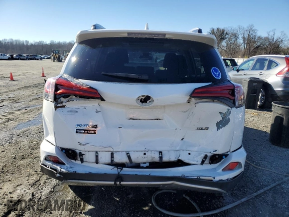 2018 Toyota RAV4 XLE with VIN 2T3WFREV2JW454202, listed as a Copart auction lot 41599855 with 144,442 mi miles and Salvage title. Bid and sale history available at DreamBid. Image 6.
