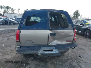 1999 GMC Yukon with VIN 1GKEK13R8XJ804104, listed as a IAAI auction lot 41359701 with 296,522 mi miles. Bid and sale history available at carsss.com. Image 16.