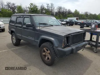 1999 Jeep Cherokee Sport with VIN 1J4FF68S9XL635836, listed as a Copart auction lot 59573195 with 187,035 mi miles and Salvage title. Bid and sale history available at DreamBid. Image 4.
