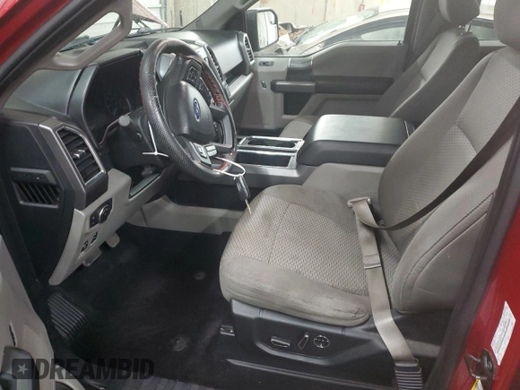 2015 Ford F-150 XLT with VIN 1FTEW1EP7FFC49319, listed as a Copart auction lot 56142895 with 125,052 mi miles and Salvage title. Bid and sale history available at DreamBid. Image 7.
