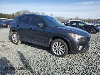 2014 Mazda CX-5 Grand Touring with VIN JM3KE2DY4E0323603, listed as a Copart auction lot 49884835 with 0 mi miles and Salvage Title. Bid and sale history available at carsss.com. Image 4.