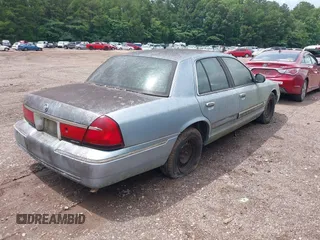 1999 Mercury Grand Marquis GS z VIN 2MEFM74W8XX686921, wystawiony jako IAAI lot #42374777 z przebiegiem 185 166 mil mil oraz . Historia ofert i sprzedaży dostępna na DreamBid. Obrazek 4.