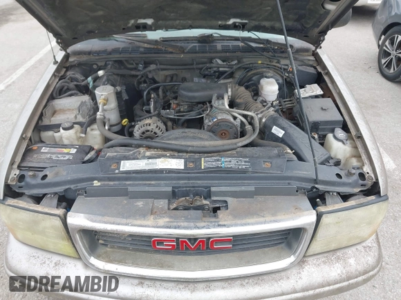 2003 GMC Sonoma SLS z VIN 1GTCS19X838182906, wystawiony jako IAAI lot #41986178 z przebiegiem Nie podano mil oraz . Historia ofert i sprzedaży dostępna na DreamBid. Obrazek 10.