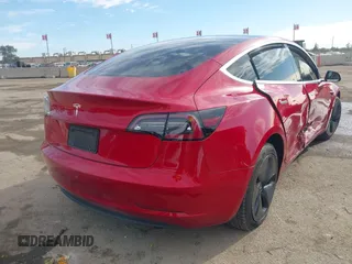 2020 Tesla Model 3 Standard Range Plus with VIN 5YJ3E1EA9LF718027, listed as a IAAI auction lot 41679320 with 68,987 mi miles. Bid and sale history available at carsss.com. Image 4.