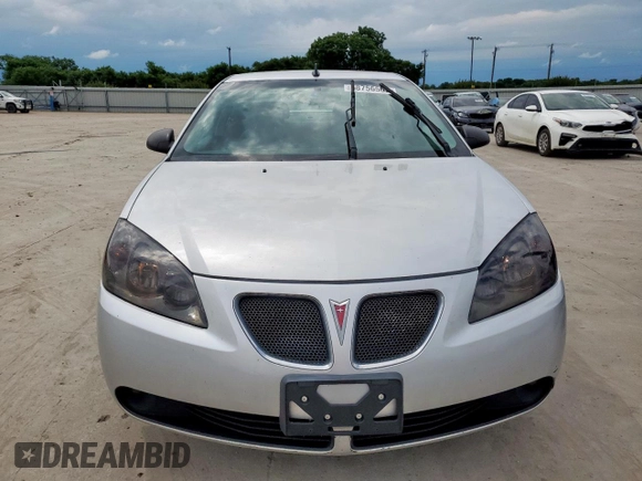 2009 Pontiac G6 1SA z VIN 1G2ZG57N394176715, wystawiony jako Copart lot #58756565 z przebiegiem 137 416 mil mil oraz Czysty tytuł • Clean title. Historia ofert i sprzedaży dostępna na DreamBid. Obrazek 5.