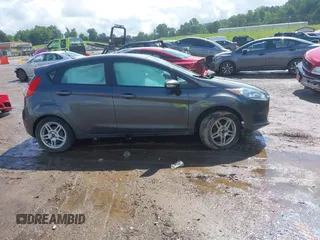 2019 Ford Fiesta SE z VIN 3FADP4EJ9KM125252, wystawiony jako IAAI lot #42221622 z przebiegiem 57 366 mil mil oraz . Historia ofert i sprzedaży dostępna na DreamBid. Obrazek 14.