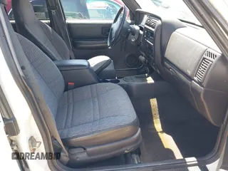 1999 Jeep Cherokee Sport with VIN 1J4FT68S1XL522018, listed as a IAAI auction lot 42551567 with 180,221 mi miles and . Bid and sale history available at DreamBid. Image 5.
