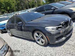 2016 BMW 7 Series 740i with VIN WBA7E2C52GG504096, listed as a Copart auction lot 49258935 with 111,267 mi miles and Salvage Title. Bid and sale history available at carsss.com. Image 4.