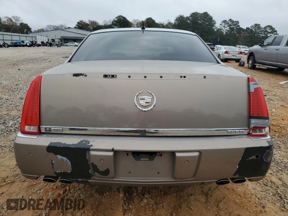 2007 Cadillac DTS V8 z VIN 1G6KD57Y47U115566, wystawiony jako Copart lot #88487785 z przebiegiem 93 484 mil mil oraz Szkoda całkowita • Salvage title. Historia ofert i sprzedaży dostępna na DreamBid. Obrazek 6.