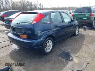 2004 Ford Focus ZX5 z VIN 3FAFP37334R120359, wystawiony jako IAAI lot #41922026 z przebiegiem 115 789 mil mil oraz . Historia ofert i sprzedaży dostępna na DreamBid. Obrazek 4.