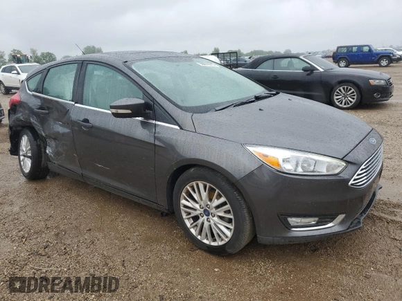 2018 Ford Focus Titanium z VIN 1FADP3N21JL295883, wystawiony jako Copart lot #59051015 z przebiegiem 43 284 mil mil oraz Szkoda całkowita • Salvage title. Historia ofert i sprzedaży dostępna na DreamBid. Obrazek 4.