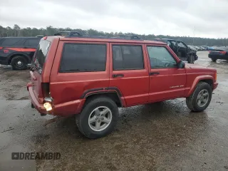 1999 Jeep Cherokee Sport with VIN 1J4FT68S1XL601799, listed as a Copart auction lot 83881844 with 203,572 mi miles and Salvage title. Bid and sale history available at DreamBid. Image 3.