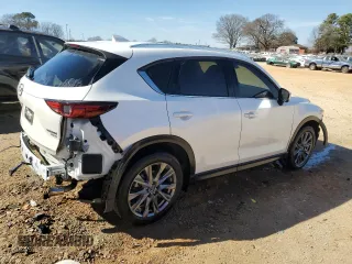 2021 Mazda CX-5 Signature with VIN JM3KFBEY5M0352778, listed as a Copart auction lot 47016035 with 37,961 mi miles and Salvage Title. Bid and sale history available at carsss.com. Image 3.