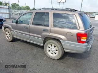 2001 Jeep Grand Cherokee Laredo z VIN 1J4GX48N51C548958, wystawiony jako IAAI lot #42460303 z przebiegiem 210 379 mil mil oraz . Historia ofert i sprzedaży dostępna na DreamBid. Obrazek 3.
