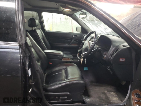 1997 Nissan Maxima with VIN HBY33200347, listed as a Copart auction lot 47182085 with 173,662 mi miles and Salvage title. Bid and sale history available at DreamBid. Image 7.