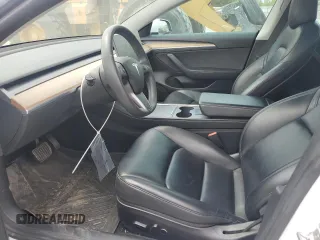 2021 Tesla Model 3 Standard Range Plus z VIN 5YJ3E1EAXMF973450, wystawiony jako Copart lot #52766645 z przebiegiem 66 827 mil mil oraz Szkoda całkowita • Salvage title. Historia ofert i sprzedaży dostępna na DreamBid. Obrazek 7.