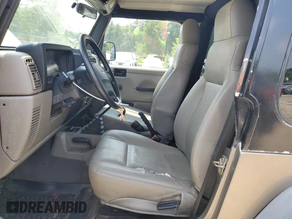 2004 Jeep Wrangler SE with VIN 1J4FA29164P797604, listed as a Copart auction lot 59978155 with 166,888 mi miles and Clean title. Bid and sale history available at DreamBid. Image 7.