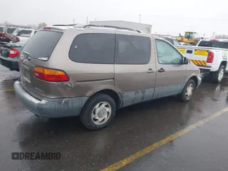 1999 Toyota Sienna LE with VIN 4T3ZF13C9XU164032, listed as a IAAI auction lot 41916673 with 296,628 mi miles and . Bid and sale history available at DreamBid. Image 4.
