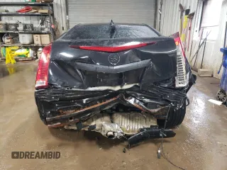 2014 Cadillac CTS Performance z VIN 1G6DG1E37E0103321, wystawiony jako Copart lot #52013005 z przebiegiem 70 394 mil mil oraz Szkody całkowita. Historia ofert i sprzedaży dostępna na DreamBid. Obrazek 6.