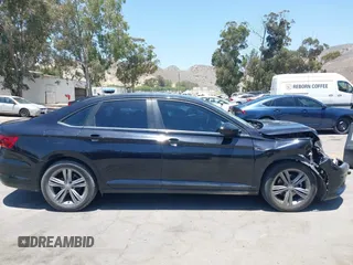 2019 Volkswagen Jetta S z VIN 3VWC57BU1KM116991, wystawiony jako IAAI lot #42377777 z przebiegiem 70 910 mil mil oraz . Historia ofert i sprzedaży dostępna na DreamBid. Obrazek 13.