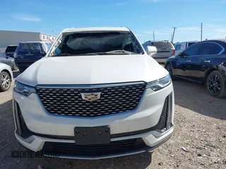 2021 Cadillac XT6 Premium Luxury z VIN 1GYKPCRS6MZ230499, wystawiony jako IAAI lot #41808404 z przebiegiem 86 933 mil mil oraz . Historia ofert i sprzedaży dostępna na DreamBid. Obrazek 13.