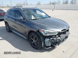 2016 BMW X1 xDrive28i z VIN WBXHT3Z32G4A51873, wystawiony jako IAAI lot #41843838 z przebiegiem 100 737 mil mil oraz . Historia ofert i sprzedaży dostępna na DreamBid. Obrazek 1.