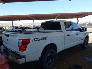 2019 Nissan Titan Pro-4X with VIN 1N6BA1F45KN533051, listed as a IAAI auction lot 42587343 with 134,768 mi miles and . Bid and sale history available at DreamBid. Image 4.