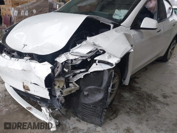 2023 Tesla Model Y Long Range z VIN 7SAYGAEEXPF789037, wystawiony jako IAAI lot #41551605 z przebiegiem 8 630 mil mil oraz . Historia ofert i sprzedaży dostępna na DreamBid. Obrazek 6.