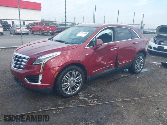 2018 Cadillac XT5 Premium Luxury FWD z VIN 1GYKNERS2JZ242842, wystawiony jako IAAI lot #42297159 z przebiegiem 72 008 mil mil oraz . Historia ofert i sprzedaży dostępna na DreamBid. Obrazek 18.