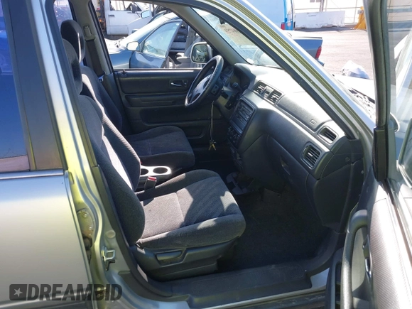 1999 Honda CR-V EX with VIN JHLRD1861XC007657, listed as a IAAI auction lot 42004759 with 180,078 mi miles. Bid and sale history available at carsss.com. Image 5.