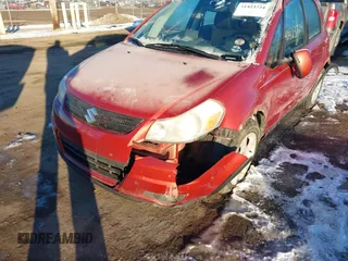 2009 Suzuki SX4 Man Touring Pkg AWD with VIN JS2YB417996202822, listed as a IAAI auction lot 41423724 with 181,531 mi miles. Bid and sale history available at carsss.com. Image 6.