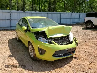 2012 Ford Fiesta SE z VIN 3FADP4BJ7CM164850, wystawiony jako Copart lot #51680925 z przebiegiem 184 884 mil mil oraz Szkoda całkowita • Salvage title. Historia ofert i sprzedaży dostępna na DreamBid. Obrazek 10.