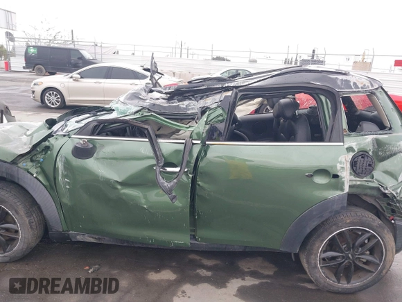 2015 MINI Countryman z VIN WMWZB3C59FWR43209, wystawiony jako IAAI lot #41761218 z przebiegiem Nie podano mil oraz . Historia ofert i sprzedaży dostępna na DreamBid. Obrazek 14.