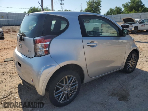 2012 Scion iQ with VIN JTNJJXB05CJ010539, listed as a Copart auction lot 56489245 with 114,623 mi miles and Salvage title. Bid and sale history available at DreamBid. Image 3.