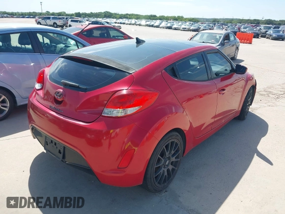2013 Hyundai Veloster w/Black Int with VIN KMHTC6AD9DU135318, listed as a IAAI auction lot 42632212 with 97,485 mi miles and . Bid and sale history available at DreamBid. Image 4.