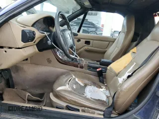 1999 BMW Z3 2.5 z VIN 4USCH9332XLF79854, wystawiony jako Copart lot #73642944 z przebiegiem 175 110 mil mil oraz Szkody całkowita. Historia ofert i sprzedaży dostępna na DreamBid. Obrazek 7.